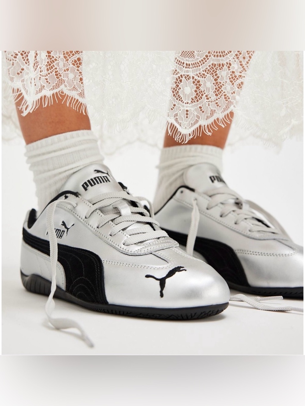 Puma Women’s Silver Sneakers with Black Stripe